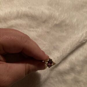 Gold band with faux ruby stone. Size 9